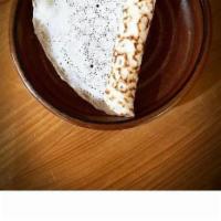 Appam · House-made fermented coconut bread.<br />