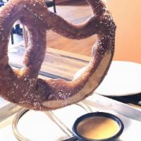 Pretzel & Beer Cheese · Pretzel and beer cheese-a pretzel as big as your face served with Yummy beer cheese made wit...