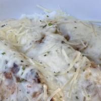 Garlic Parmesan Chicken & Rice · Seared chicken served on a bed of white rice. Topped with our house-made garlic parmesan sau...