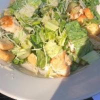 Caesar Salad · Romaine lettuce tossed with Caesar dressing, parmesan cheese, and croutons.