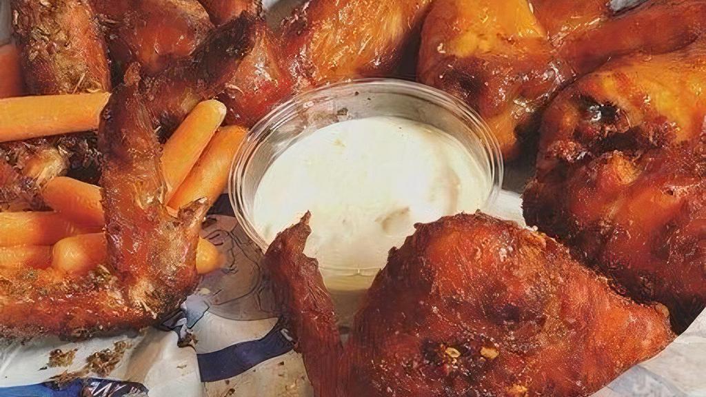 Full Smoked Wings Delivery · 6 whole wings, marinated, slow smoked, flash fried, served with a roll, carrots, and ranch or blue cheese dressing