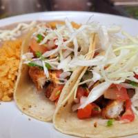#13 Two Fish Taco · Two Fried Cod Fish Tacos Topped WIth Chipotle Mayo , Pico De Gallo , & Cabbage served with a...
