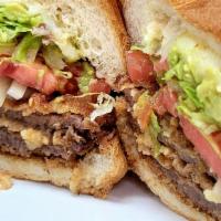 Milanesa Torta · Milanesa is a  Breaded Steak with,  Lettuce, Tomatoes, . Onions, Guacamole and Melted Cheese .