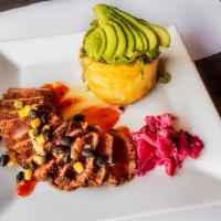 Southwestern Ahi Salad · Seared ahi tuna, mixed greens, avocado, corn relish, pickled veggies and strawberries, pinea...