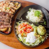 Grilled Fajitas · Served with grilled onions, tomatoes, red and green peppers, pico, crema, and guacamole