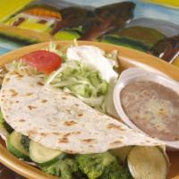 Veggie Quesadilla · A quesadilla stuffed with cheese, mushrooms, broccoli, zucchini, squash, bell peppers and on...