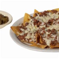 Nachos With Refried Beans · Chips with cheese and beans.