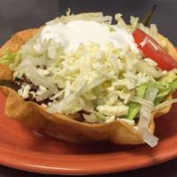 Fajita Taco Salad · A crisp flour tortilla filled with your choice of fajita-style beef, chicken, or shrimp, ref...