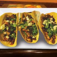 Tacos Chupa Cabras · Steak, chicken, and chorizo with cilantro and onions. Served with rice and beans.