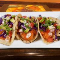 Tacos De Camaron · Two flour tortilla tacos filled with grilled shrimp covered with chipotle cream sauce served...