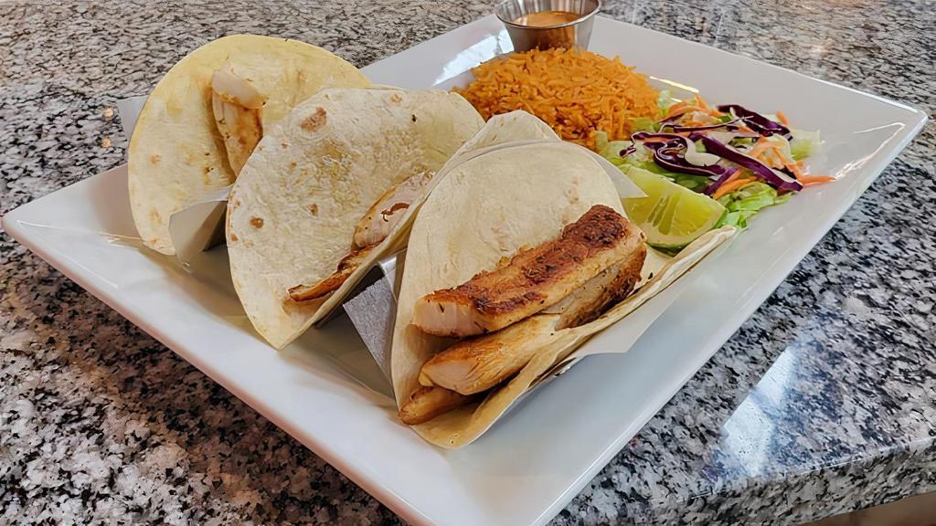 New Mahi Mahi Tacos · 3 mahi mahi tacos, rice and salad , avocado and chipotle sauce on the side