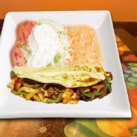 Quesadilla Texana · Quesadillas with tender steak, grilled chicken, shrimp, bell peppers, grilled onions and tom...