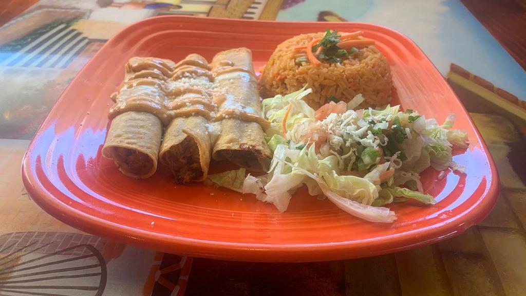 Flautas De Pollo · Three deep-fried tortillas stuffed with chicken and cheese dip. Served with chipotle cream on top, pico de gallo, rice, and lettuce.