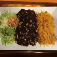 Mole Poblano · Chicken breast topped with sweet mole poblano sauce. Served with rice, guacamole salad, and ...