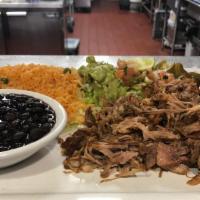Carnitas · Fried pork meat served with Spanish rice, re-fried beans, guacamole salad, pico de gallo, an...