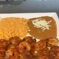 Camarones A La Diabla · Spicy. Shrimp covered with a diabolically hot sauce. Served with Spanish rice, refried beans...