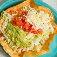 Taco Salad · Crispy flour tortilla bowl filled with ground beef or shredded chicken, cheese, beans, lettu...