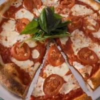 Margherita Pizza · Buffalo mozzarella, tomato, and basil.