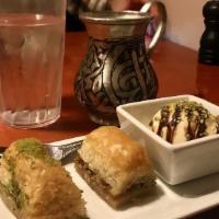 Baklava · Layers of phyllo dough covered with ground pistachios or walnut and sweet syrup. Topped with...