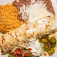 Burrito California · Extra-large flour tortilla, lettuce, sour cream, guacamole, and pico de gallo, covered with ...