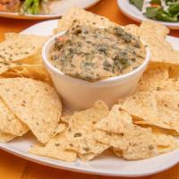 Swamp Dip · Crawfish, Crabmeat, and Shrimp in our Creamy Spinach Dip.