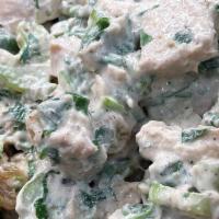 Chicken Salad · Chopped chicken breast, celery, golden raisins, walnuts, mayonnaise, parsley, and spices. (G...