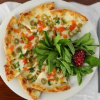 Tomato Olive Pizzette · Vegetarian. Fresh tomatoes, green olives, a three cheese blend, garlic and parsley.