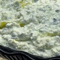 Tatziki · Vegetarian. Tart Lebanese yogurt, cucumber, olive oil, garlic, and mint mixed into a tangy d...