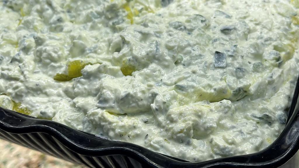 Tatziki · Vegetarian. Tart Lebanese yogurt, cucumber, olive oil, garlic, and mint mixed into a tangy dip. (gluten free)
