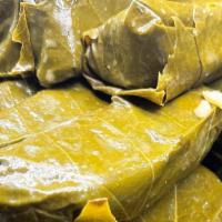 Grape Leaves · Vegetarian. Grape vine leaves stuffed with rice, diced tomatoes, spices and olive oil. Baked...