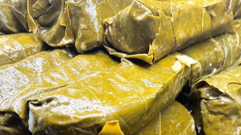 Grape Leaves · Vegetarian. Grape vine leaves stuffed with rice, diced tomatoes, spices and olive oil. Baked to perfection. (vegan, gluten free)