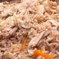 Makloube · Rice, roasted chicken and carrots, seasoned with cinnamon, nutmeg and other flavorful spices...