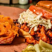 Bbq Pulled Chicken Sandwich · Slow smoked bbq chicken, creamy white slaw, tomato, sweet southern sauce, or SC mustard hot....