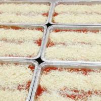 Baked Manicotti · Jumbo pasta tubes stuffed with ricotta cheese and topped with homemade marinara sauce and mo...