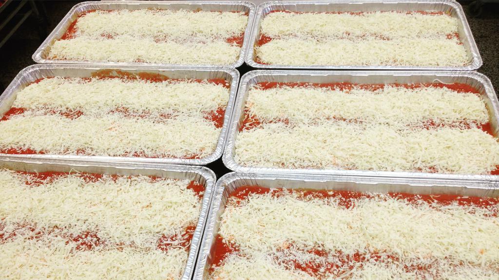 Baked Manicotti · Jumbo pasta tubes stuffed with ricotta cheese and topped with homemade marinara sauce and mozzarella cheese. Served with garlic or plain knots.