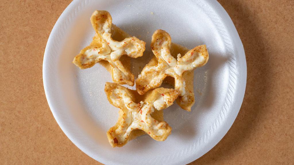 Crab Rangoon · Fried wonton wrapper filled with crab and cream cheese.