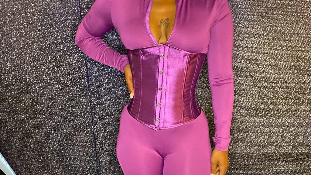 Body Jumpsuit - Set (Purple) · Soft stretchy long sleeved solid color jumpsuit with thumb pocket. Adjustable color coordinated corset included! 

Fit: true to size.