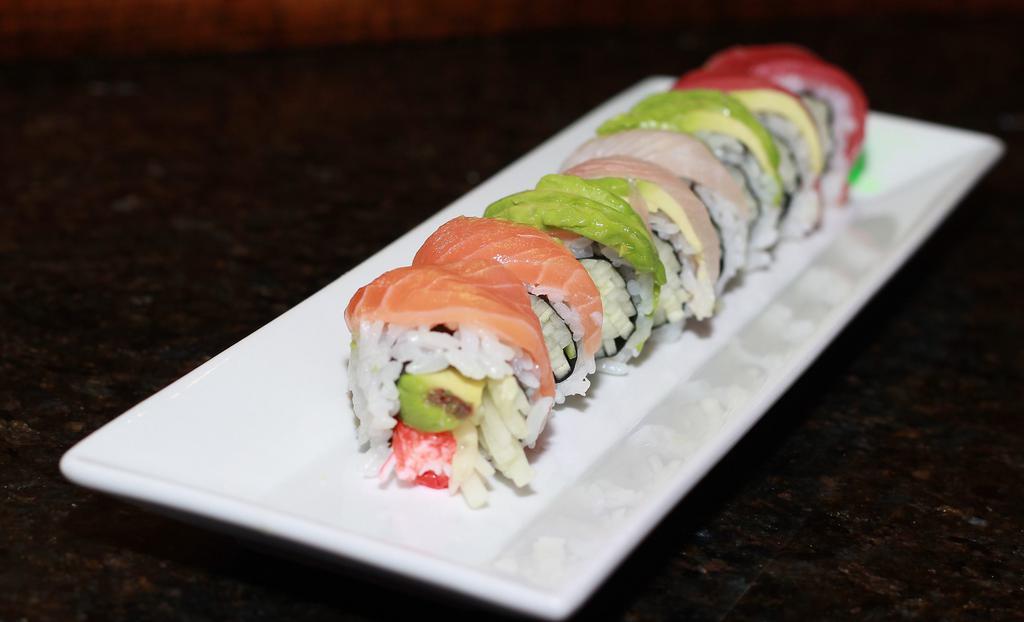 Rainbow Roll · Crabmeat, avocado, cucumber with tuna,salmon , white fish and avocado on top.