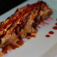 Rancho Roll · Hot and spicy. Deep fried salmon, cream cheese, avocado with jalapeno and spicy sauce on top.