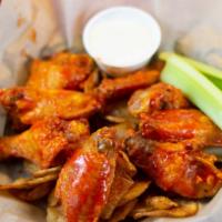 Classic Bone-In Wings · One pound of bone-in chicken wings tossed in one of our tasty housemade sauces. Served over ...