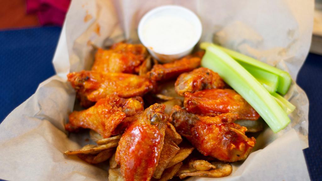 Classic Bone-In Wings · One pound of bone-in chicken wings tossed in one of our tasty housemade sauces. Served over housemade Old Bay chips with celery sticks and your choice of dressing.