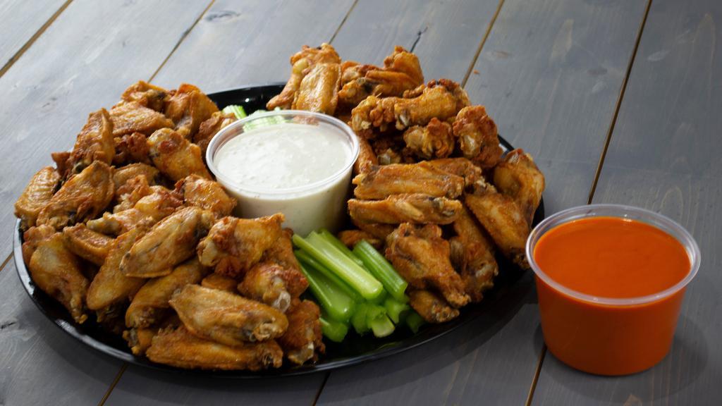 Classic Wings Tray · A combination of wings and drumettes served with celery sticks and your choice of bleu cheese or ranch dressing. Choose your housemade sauce.