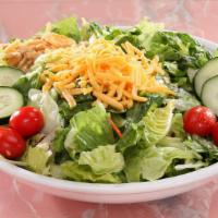 Garden Salad · A lite choice. Mixed greens, red cabbage, shredded carrots, cucumbers, cherry tomatoes, shre...