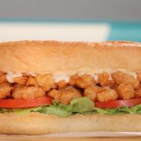Shrimp Po'Boy · Our spin on a New Orleans favorite. A large portion of hand-breaded shrimp served in a hoagi...