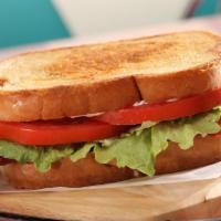 Blt · Loaded with bacon and tomato. Five slices of crispy bacon topped with lettuce, tomato mayo, ...