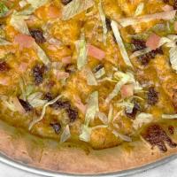 Taco Pizza · Freshly baked pizza with a NY Style crust and homemade pizza sauce ,  topped with 100% mozza...