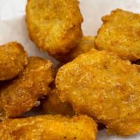 10 Piece Chicken Nuggets · Bite-sized, seasoned battered Chicken that is crispy on the outside but tender on the inside...