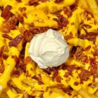 Loaded Bacon Cheese Fries · One pound of extra crispy fries, topped with melted cheese and bacon, and served with a side...