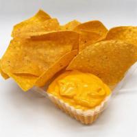 Nachos & Cheese · Made to order nachos and served with a side of melted nacho cheese.