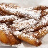 Funnel Cake Fries · Deliciously deep fried funnel cake fries, topped with powdered sugar.  Guaranteed to satisfy...